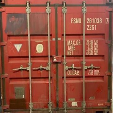 Sheltered storage facility for hazardous waste material